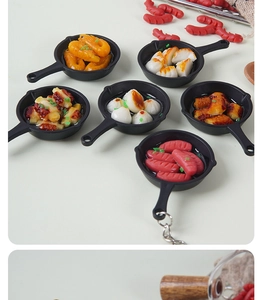 Top view of mini frying pan keychain charms with various miniature food models