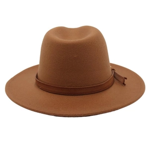 Detail of dark brown wool fedora hat with elegant leather belt buckle strap