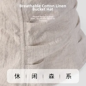 Close-up of beige linen bucket hat showing breathable fabric texture and pleated detail