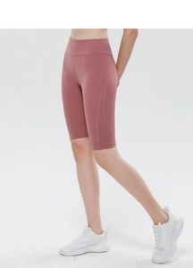 Detail of high-waisted rose pink fitness shorts with ergonomic curved side stitching