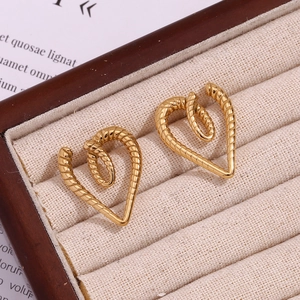 Macro detail of 18K gold plated heart stud earrings with twisted rope texture design