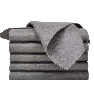 Stack of thick gray microfiber magic cleaning cloths for streak-free glass polishing