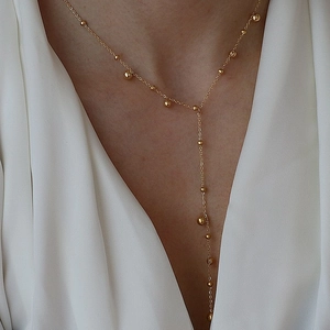 Minimalist 18k gold plated Y-shaped necklace featuring elegant gold beads for women