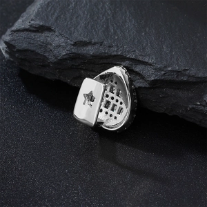 Macro shot of silver-plated hip hop tooth cap with white zircon and star cutout detail