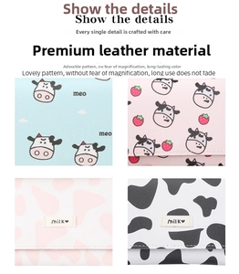 Close-up of litchi pattern faux leather wallets with cow prints and cute milk embroidery