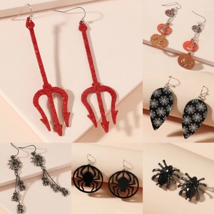 Halloween earring set featuring pumpkin, spider, and web motifs in vibrant finishes