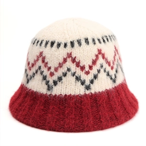 Detailed macro view of the fluffy wool blend texture and knit pattern on the bucket hat