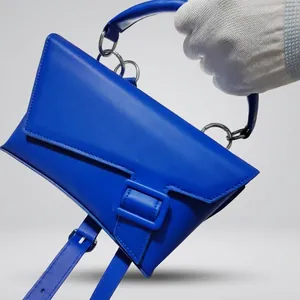 Klein blue geometric crossbody chest bag with adjustable strap and designer buckle