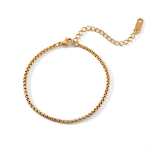 Detailed close-up of golden stainless steel box chain with engraved S.steel quality tag