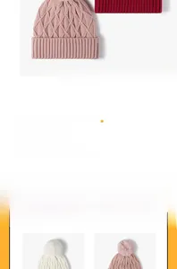 Detail view of the thick cable knit texture and soft pom-pom on this warm winter beanie