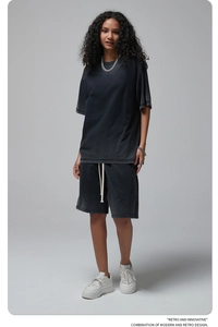Detail of oversized washed black cotton summer set with vintage distressed texture