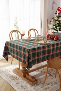 Close-up of red and green plaid festive tablecloth with soft natural lighting for Christmas