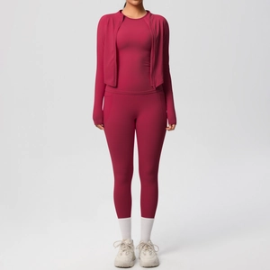 Detailed view of dark red yoga set featuring zipper jacket and high waist leggings