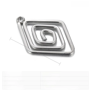 Macro detail of geometric rhombus pendant in stainless steel for jewelry making