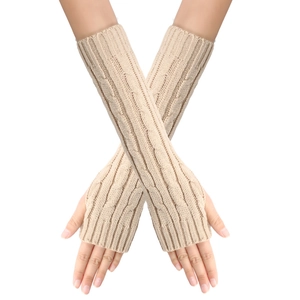Close-up of beige cable knit fingerless gloves with elegant twist pattern texture