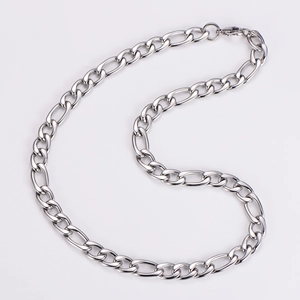 Close-up of 11mm silver stainless steel Figaro link chain with polished metallic texture