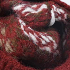 Thick winter knit beanie featuring red striped jacquard pattern and warm wool texture