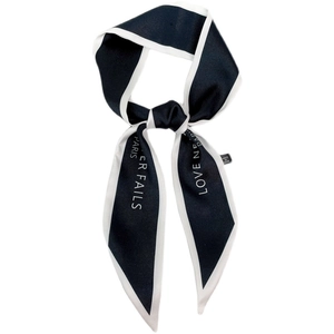 French vintage style silk scarf hair ribbon in black and white with LOVE NEVER FAILS print