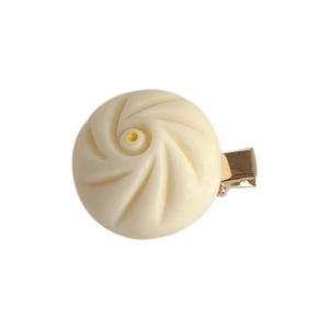Cute large steamed bun hair clip in off-white resin with realistic details and metal grip