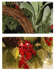 Detail of Christmas wreath featuring red berries, frosted green leaves and LED lights on vine base