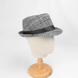 Detail of grey plaid fedora hat with black ribbon trim on professional mannequin