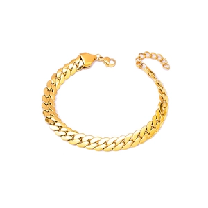 Polished golden Cuban link bracelet with lobster clasp and extension chain on white background