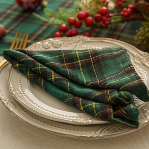 Green and yellow plaid Christmas table runner and napkin set for festive dining decoration