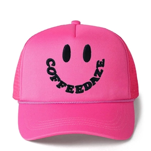 Pink mesh trucker hat with black Coffee Daze smiley embroidery and decorative front rope