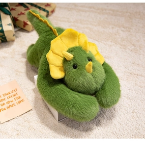 Close-up of cute green plush triceratops toy with bright yellow crest on cozy carpet