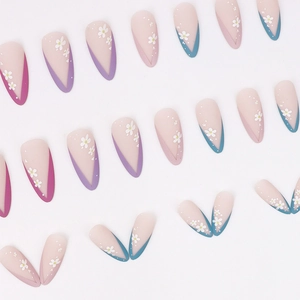 Matte almond press-on nails with colorful French tips and delicate white flower patterns