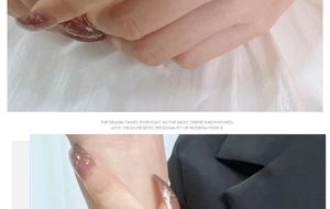 Detail of long almond-shaped amber press-on nails with gold leaf foil and glossy finish