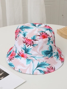 Flat lay of pink and blue floral print bucket hat for outdoor sun protection on a table