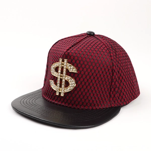 Detail of red and black mesh baseball cap featuring a gold rhinestone dollar sign emblem
