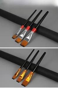 Detail of two nylon flat brush sets with black glossy handles and metal ferrules