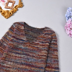 Detail of V-neck cropped knit top featuring colorful horizontal stripes and fuzzy texture