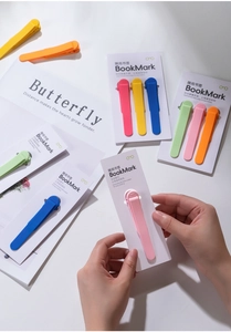 Macro detail of various colorful silicone bookmarks with automatic page tracking features