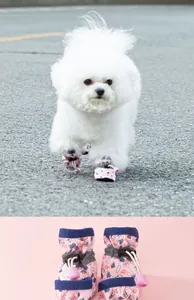 Detail of pink cartoon pet shoes with adjustable drawstrings and anti-slip sole for dogs