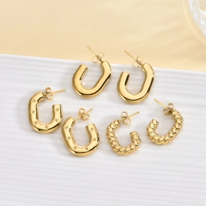 Three-piece set of 18K gold-plated chunky hoop earrings with smooth, star, and twisted designs