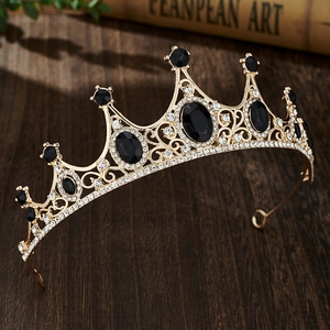 Macro detail of vintage gold crown with black gems and sparkling rhinestones