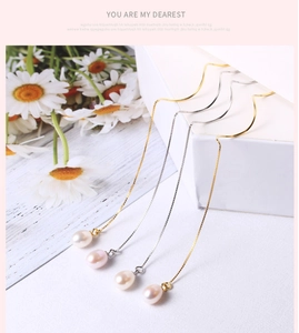 Elegant long S925 silver earring chains with teardrop pearls on a white jewelry box