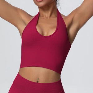 Detailed texture of dark red ribbed halter yoga top and seamless high waist leggings