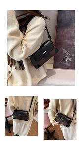 Detail of vintage two-tone shoulder bag with textured brown body and black flap