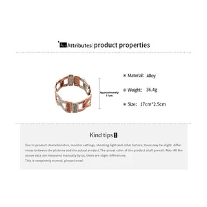 Detail of two-tone alloy bracelet featuring Inspire and Create engraved words
