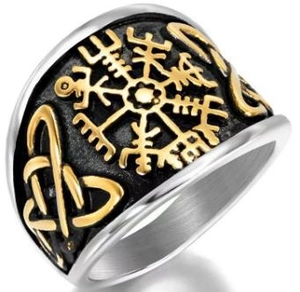 Detail view of vintage Viking ring with silver Vegvisir compass and golden Celtic knot