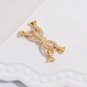 Gold butterfly bow clasp connector with micro-paved zircons and 4-way link structure