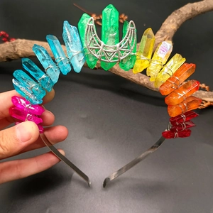 Detailed view of rainbow crystal headband with silver wire wrap and moon ornament