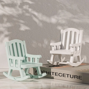 Detail view of mini mint green and white vintage European rocking chair ornaments