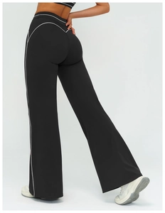 Close-up of high-waisted flared pants featuring contrasting side stripes and slim fit