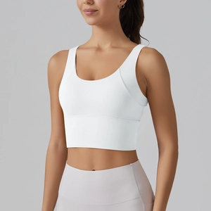 Close-up of white sports bra with U-neck design and supportive wide elastic hem