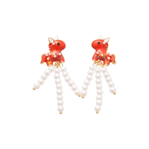 Red enamel unicorn stud earrings with white pearl tassels and gold accents on white background